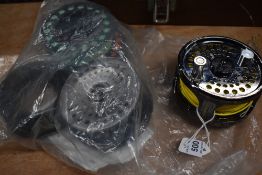 A Shakespeare Summit fly reel with spare spool and some extra fly line.