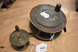Two vintage fishing reels one brass and one made from brass and wood