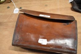 A Vintage Leather cast and fly wallet containing some casts and flies