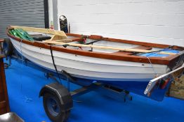 A Handbuilt fibreglass hull fishing boat with trailer and Yamaha 4 outboard motor. Measuring approx