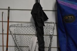 An Abu Garcia Conlon 300 8ft 2 pc rod and a Vintage 2pc Shore Caster rod both in soft sleeves