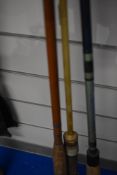 Three vintage fishing rods of varying length