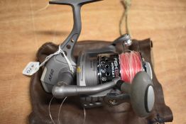 A fixed spool Fish Zone Chrome AF60 reel in leather pouch