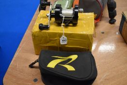 A reel from The Rocket Reel Company model TG-F2 in original soft pouch