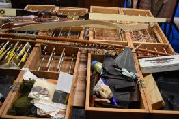 A large quantity of Archery equipment including 3 cased sets of arrows and 4 bows including 3 by
