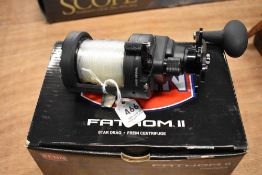 A Penn Fantom II casting special FTH 11DCS reel in box with instructions