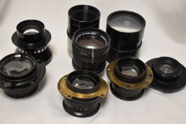 A box of brass lenses etc