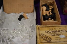 A glass chess set with a similar vintage wooden turned set and a box of Imperial double Dominoes.