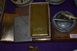 Seven vintage cigarette smokers cases with Douglas Convention ashtray.