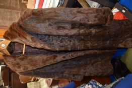 A vintage squirrel fur coat, and a fur hat, medium to large size.
