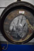 A monochrome print 'HMS Victory' the mount later sprayed with gold paint and mounted with flowers,