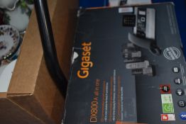 A Gigaset DX800A all in one home telephone system including three extra handsets.