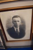 A vintage portrait print in black and white.