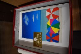 Four copies of The Grand Cayman 'The Best Of The Good Life In The Cayman Islands'.