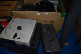 A Sankyo Dualux-8 cini film projector, a Kodak Carousel S projector, a Pack-Away Projector Stand and