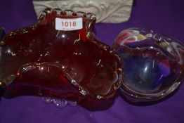 A vintage art glass bowl in a pink and purple fade signed to base, with a similar Ruby red dish.