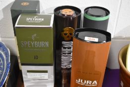 Five empty whiskey cartons including Jura, Smokehead, Speyburn, Glen Marnoch and Finlaggan.
