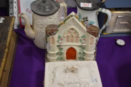 A Bristolia butter dish with a Parian ware water jug and similar water jug and a Staffordshire