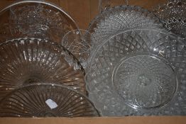 Nine glass tazza cake stands and four cut glass wine glasses.