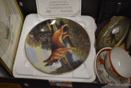 A Danbury Mint 'The Lookout' collectors plate, a metal clock with embroidered face, an eggshell