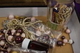 A selection of vintage costume jewellery including a Limit watch, simulated pearls and necklaces.
