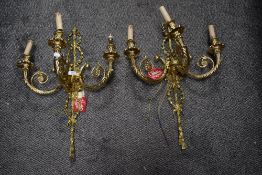 Two modern three branch wall mounted lights having a very heavy brass cast in a Regency design.