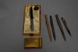 A boxed Shaeffer ink pen with two HM silver propelling pencils and two other propelling pencils.