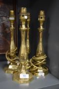 Two pairs of matching vintage brass side lamps.