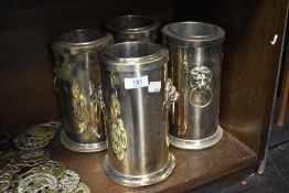 Four early 20th century silver plated wine or champagne ice buckets with lion head handles.