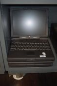 Two early Apple Macintosh laptop computers.