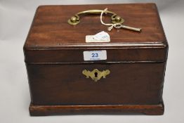 A Georgian tea caddy having an oak case with mahogany veneer and compartmental inner with velvet.