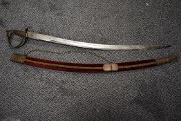 A reproduction Arabic style sword with horse head handle.