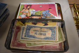 A selection of early 20th century collectable paper currency with a small collection of comedic