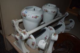A selection of matching toilet ceramics including towel rails, soap dishes and roll holders.