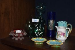 A selection of late Victorian art glass including a blue custard glass jug, Jade green and enamel