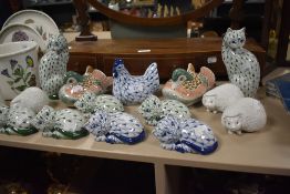 Fourteen modern hand decorated Herend style animal figure studies including cats, birds and