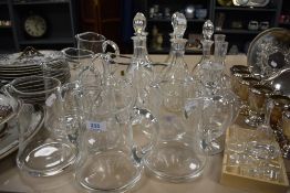 Nine as new John Jenkins and similar clear crystal glass water jugs with seven decanters and an