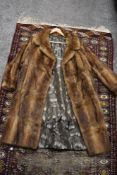 A mid century full length fur coat.
