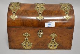 A Victorian dome topped office desk top tidy and stationary and letter rack, having a walnut case