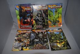 A collection of vintage Warhammer comic books.