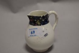A Victorian Royal Worcester sparrow beaked jug with a chintz style pattern.