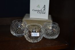 Three modern Cumbria Crystal glass ball form tumblers each with a different cut one having