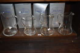 Seven John Jenkins water jugs with four having boxes.
