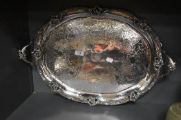 An impressive late Victorian silver plated butlers tray having scroll work boarder with acanthus