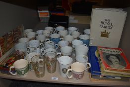 A shelf full of Royal coronation and souvenir memorabilia.