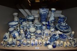A large shelf full of vintage Dutch Delft wares and similar blue and white wares.