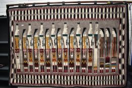 A 20th century Native American Navajo First Nations tapestry of three visitors meeting a fourteen