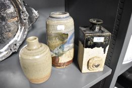 Three vintage studio pottery vases in naturalistic glazes.