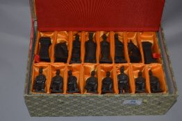 A modern Chinese chess set in the form of terracotta soldiers.