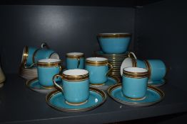 An early 20th century Cauldon part tea service having Azure blue and gilt glaze with Greek key